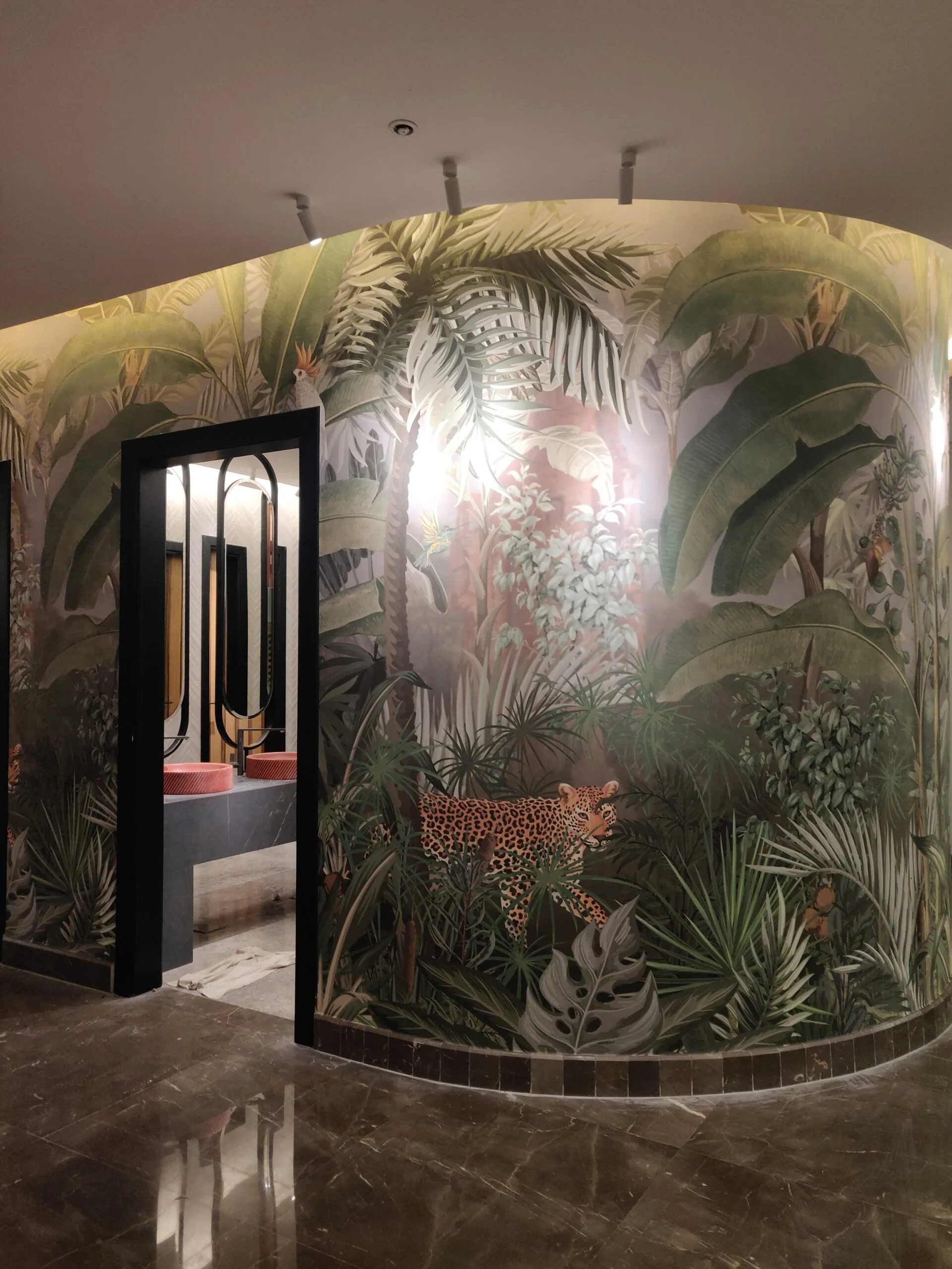 Image depicting concepts from Unique Mural Installation Around the Bathroom in a Minneapolis Restaurant. Wallpaper Twins’ custom mural brings artistry to the bathroom area in this Minneapolis restaurant, seamlessly blending function with design flair.