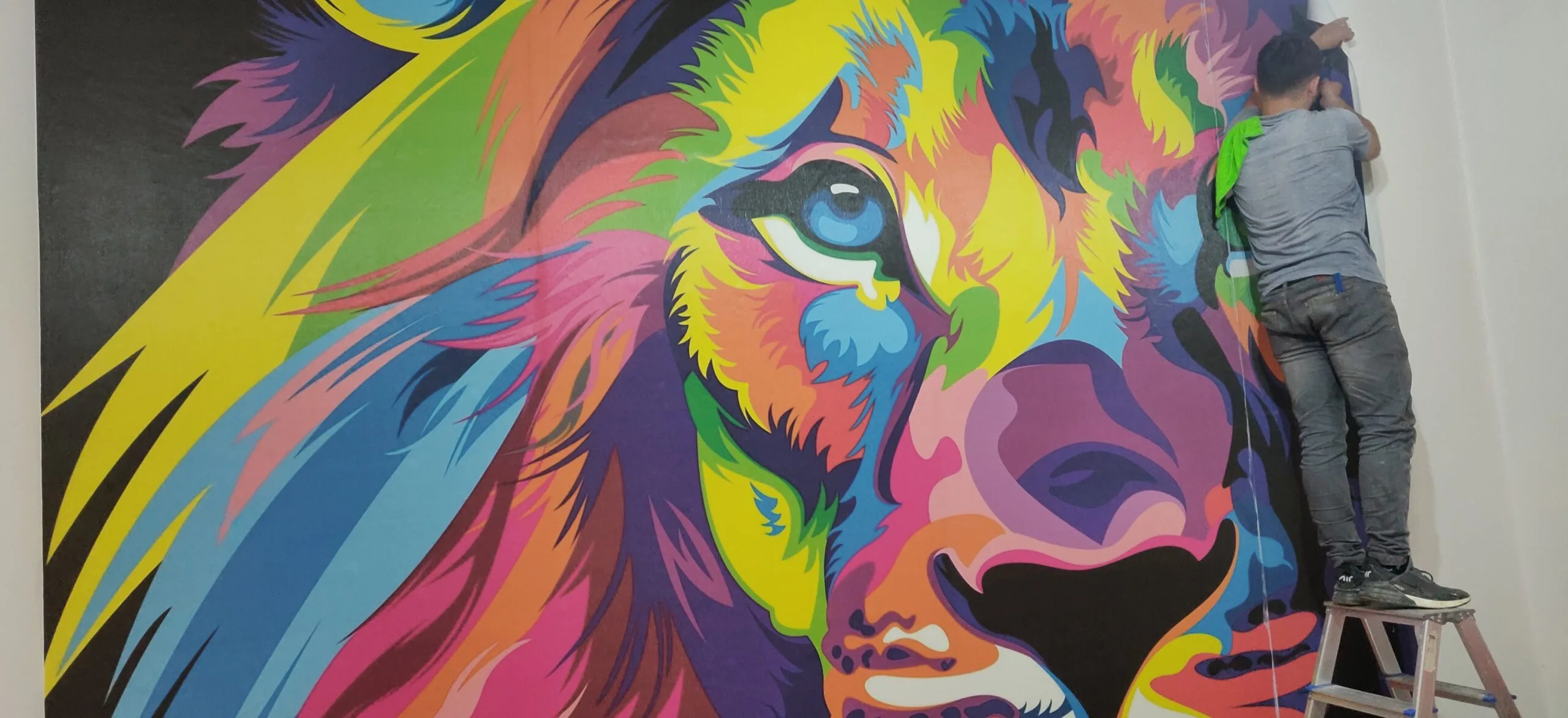 Image illustrating key points about the introduction of the blog on 'Dynamic Lion Mural Brings Life to Shoreview Residence'. Wallpaper Twins’ lion mural installation in Shoreview, Minnesota, captivates and energizes the space.