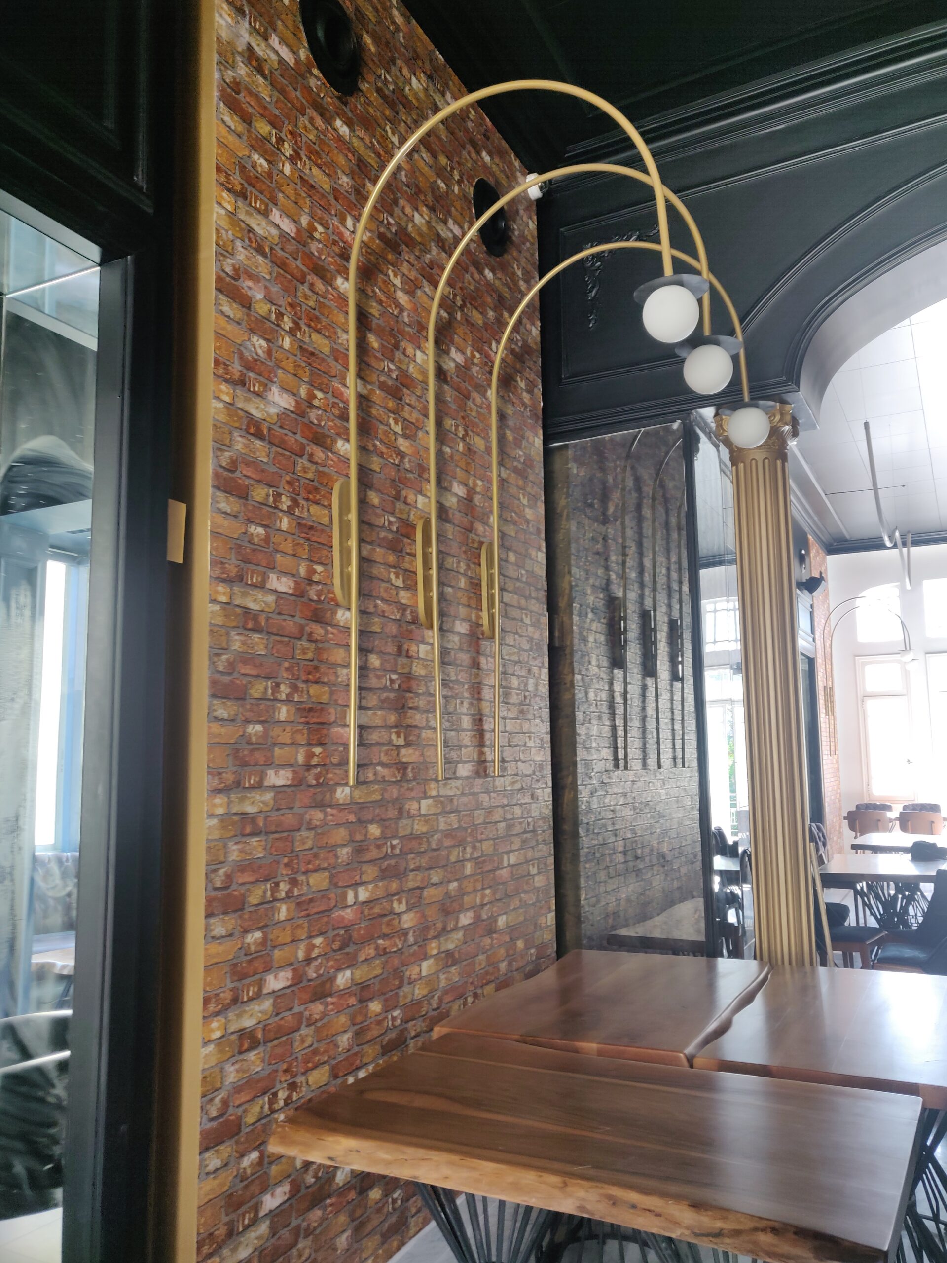 Dining area with brick wallpaper and decor.