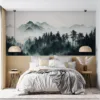 Misty mountainous landscape with tall trees and ethereal ambiance||