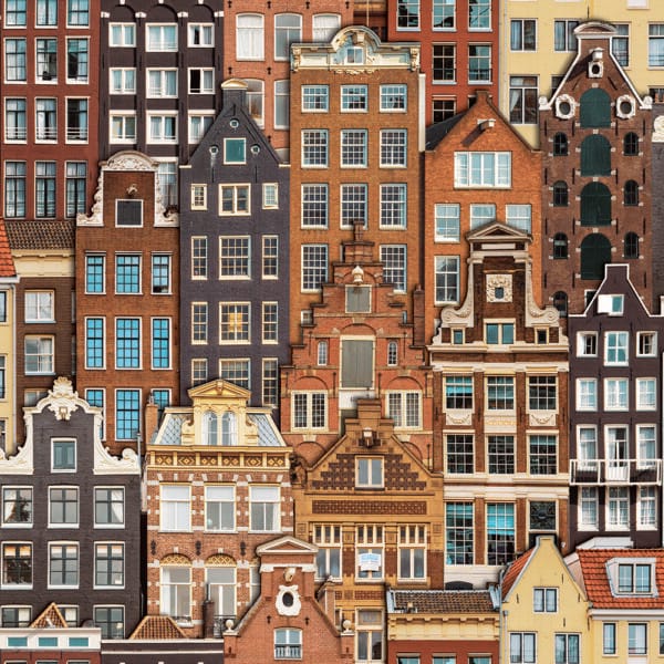 Colorful illustration of classic European row houses with varied architectural designs