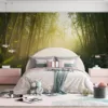 Serene bamboo forest with tall stalks and misty atmosphere||
