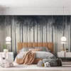 Monochromatic forest scene with tall trees and mist||
