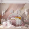 Abstract design with flowing shapes in soft pink and cream colors.||