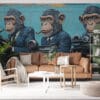 Three anthropomorphic monkeys in suits holding cameras and typewriters in a vibrant urban mural.