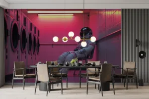 Astronaut seated in a pink-lit laundry room||