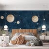 Celestial scene with moons and planets in deep blue background