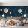 Celestial scene with moons and planets in deep blue background||