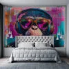 Artistic depiction of a monkey wearing sunglasses and headphones in vibrant colors.