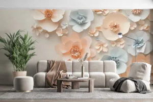 Arrangement of delicate paper flowers in pastel colors on a neutral background.