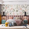 Delicate floral pattern with soft pink flowers and green leaves on a cream background.