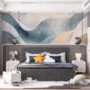Abstract design with flowing wavy shapes in soft shades of blue and beige.