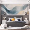 Abstract design with flowing wavy shapes in soft shades of blue and beige.||