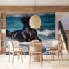 Black horse running through ocean water with splashes