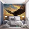 Eagle soaring in a colorful sky at sunrise or sunset||