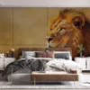 Close-up profile view of a majestic lion against a warm gradient background.||