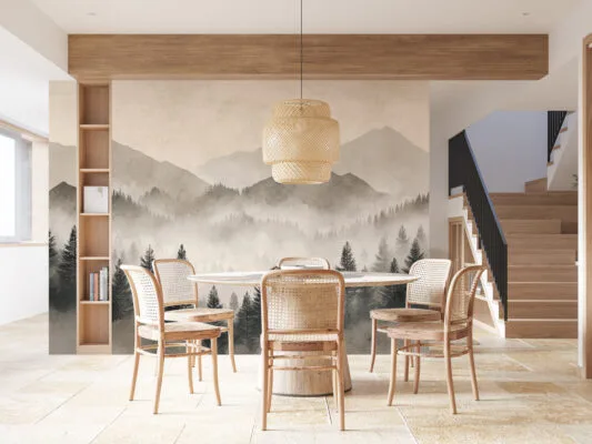 Misty mountain landscape with evergreen trees and layered mountains in soft tones.