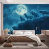 Group of wolves on a rocky ledge under a bright full moon in a misty forest.