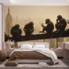 Six monkeys eating ice cream on a beam with a city skyline in the background