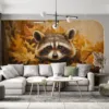 Raccoon peeking through autumn leaves||