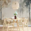 Serene forest watercolor scene with tall trees and soft muted colors.||