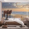 Two horses on a beach during sunset