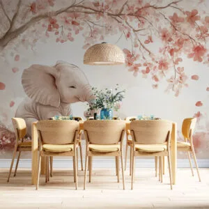 Young elephant sitting under a tree with pink blossoms in a serene environment