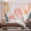 Stylized tulips in soft pink hues with green leaves and gold accents on a muted background.