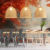 A serene autumn landscape with a traditional pagoda by tranquil water|surrounded by vibrant foliage.|