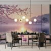 Serene lakeside landscape with cherry blossom trees at sunrise