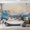Serene mountainous landscape at sunrise with shades of blue and warm tones||