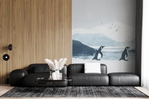 Three penguins standing on a snowy landscape with icy mountains in the background.||