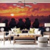 Five monkeys sitting on a rooftop overlooking a vibrant sunset in an urban landscape.