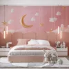 Dreamy night sky with fluffy clouds and a golden crescent moon||