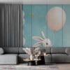 Cute cartoon rabbit holding a pink balloon in a dreamy sky with fluffy clouds and golden stars.