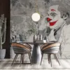 Artistic representation of a clown figure with red lips and classical illustrations in the background.||