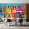 A colorful clothesline with various garments against a blue sky.