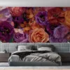 Vibrant floral arrangement in shades of purple|orange|and pink.