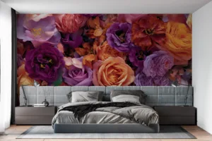 Vibrant floral arrangement in shades of purple|orange|and pink.