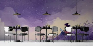 A woman sitting on a grassy hill reading on a laptop under a starry sky||
