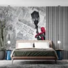 Spider-Man on a streetlamp against a textured urban background of newspaper clippings.||