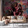 Deadpool seated on an ornate throne surrounded by colorful graffiti.||