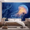 Jellyfish swimming underwater with glowing orange highlights in dark blue tones.||