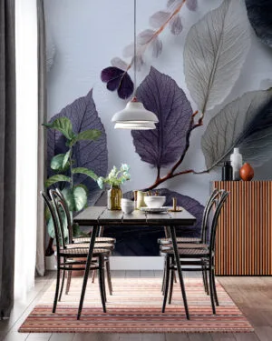 Artistic arrangement of leaves in shades of purple and grey.