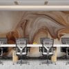 Abstract artwork with swirling patterns in warm beige