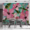 Vibrant floral design featuring hibiscus flowers against a turquoise background||