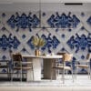 Geometric floral pattern in blue on a light background.
