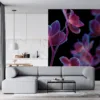 Close-up of neon orchids against a black background||