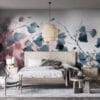 Delicate watercolor floral mural with blue and gray leaves on a pink background.