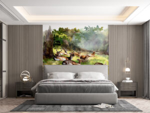 A group of deer resting in a lush green environment with soft sunlight filtering through trees.
